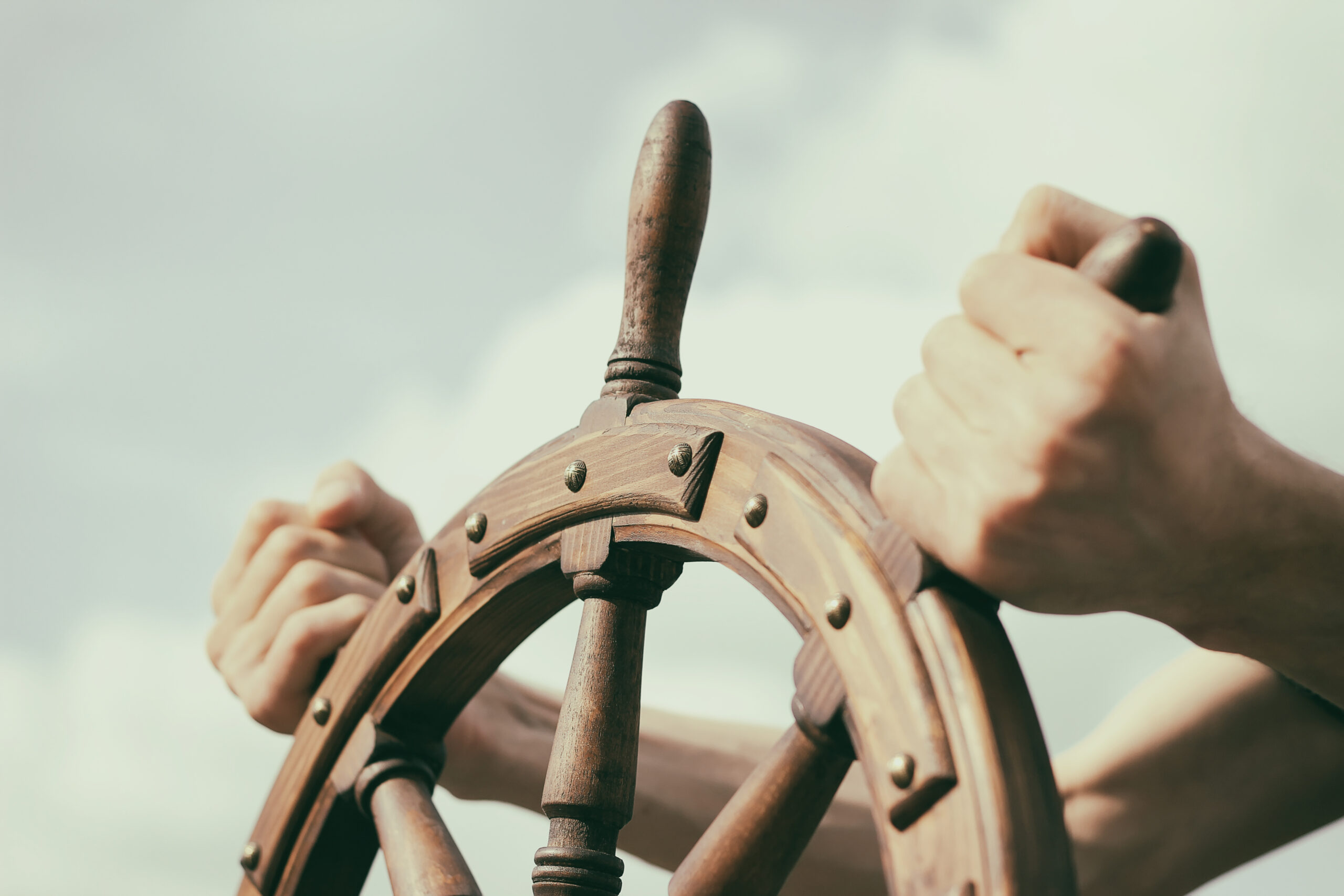 Steering hand wheel ship on sky background