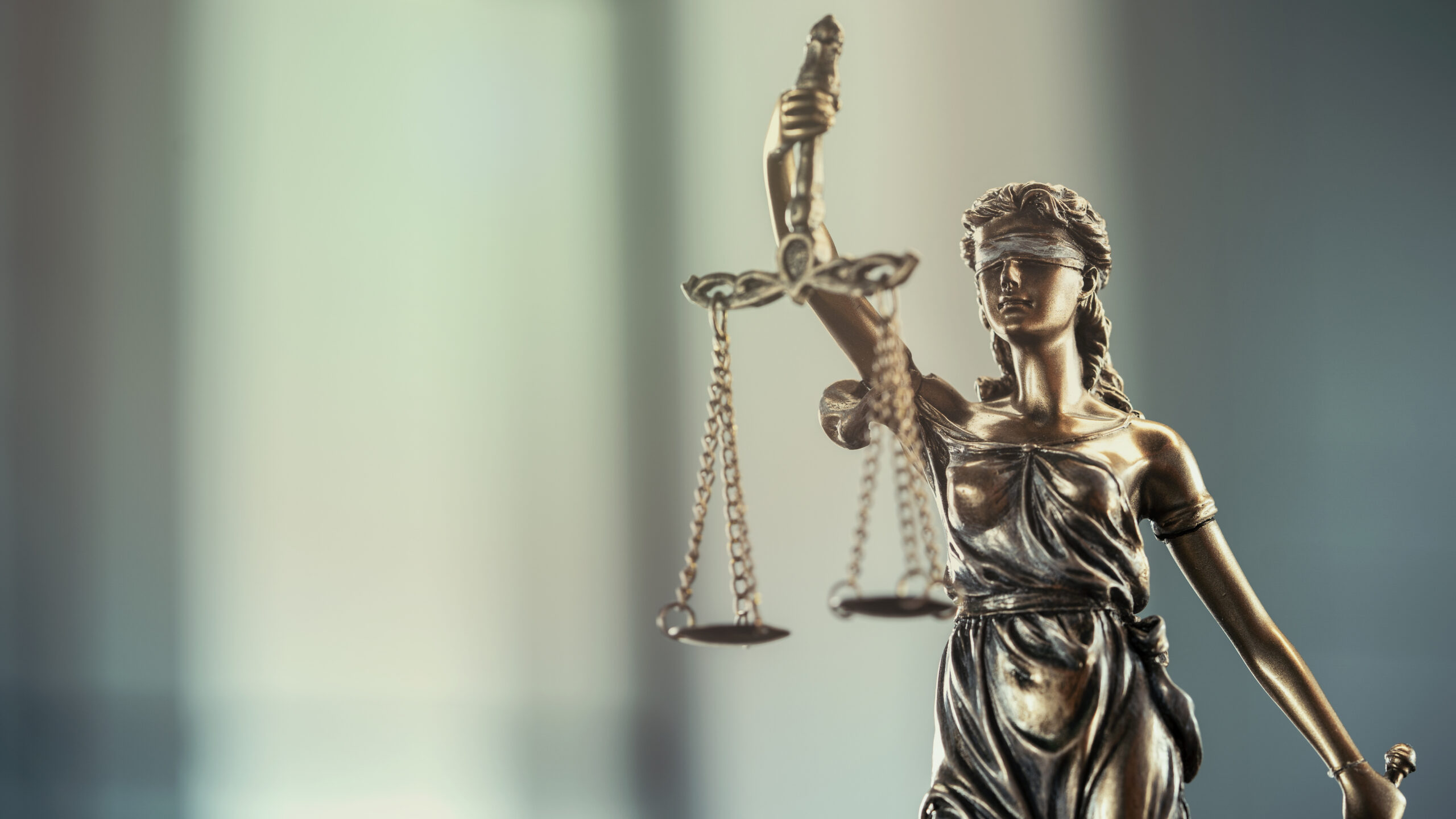 Legal and law concept statue of Lady Justice on blurred background