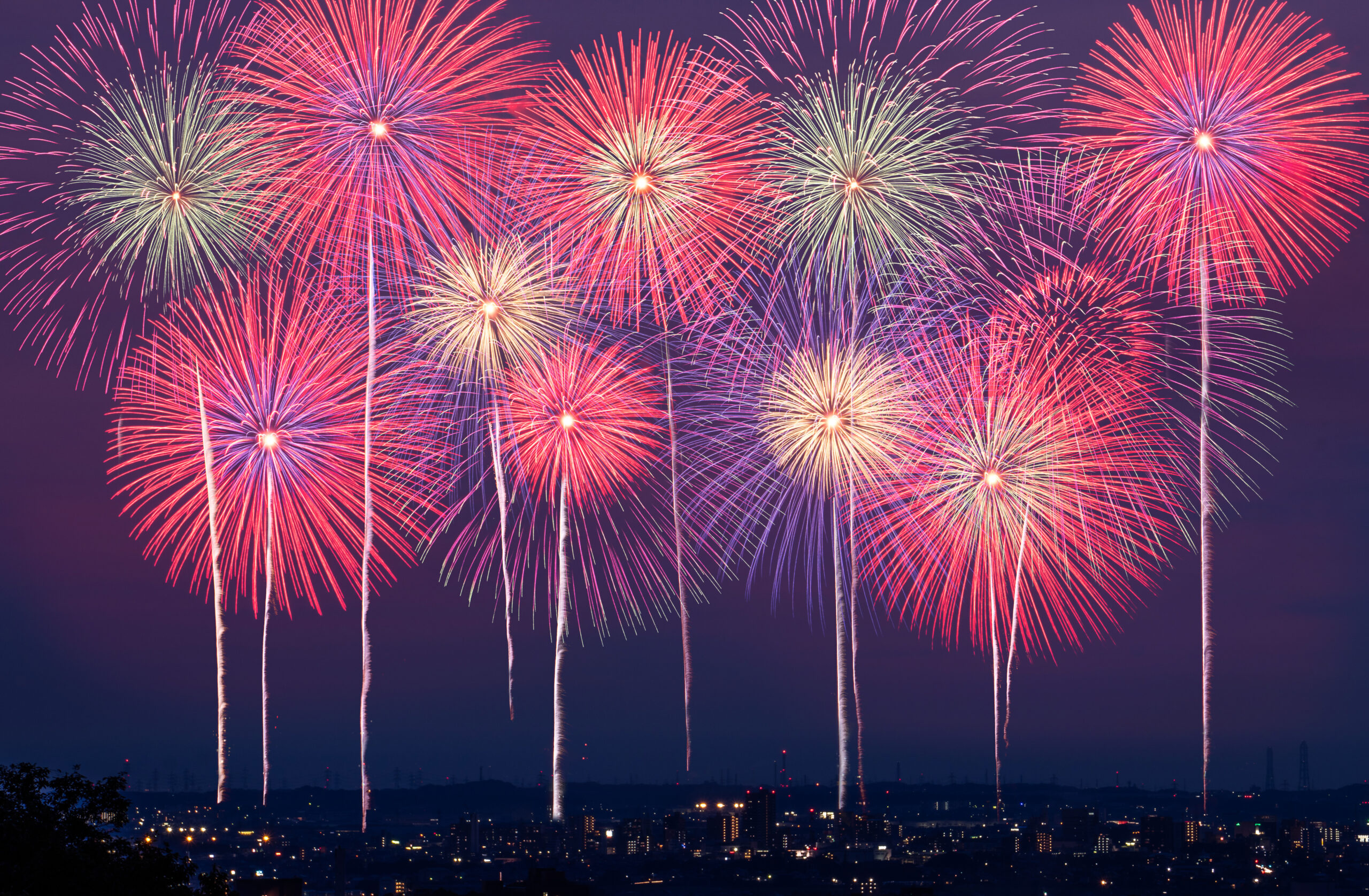 Fireworks over the cityscape at night